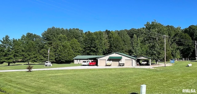 view of community featuring a yard and an outbuilding