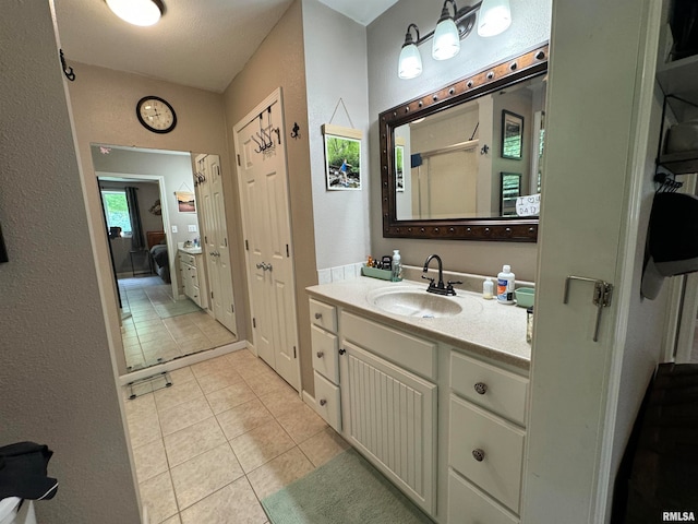 bathroom featuring tile patterned floors and vanity