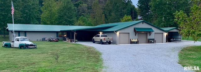 view of front of home with a garage and a front lawn