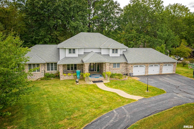 view of front facade with a garage and a front lawn