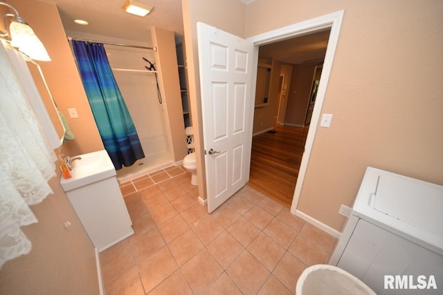 804 Williams St, Mount Vernon, IL 62864 - full bathroom with vanity, toilet, a shower with curtain, tile patterned floors, and baseboards