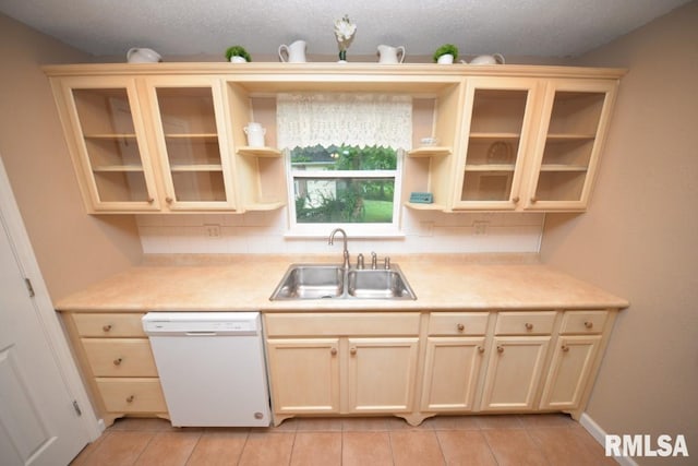 kitchen with dishwasher, decorative backsplash, a textured ceiling, and sink