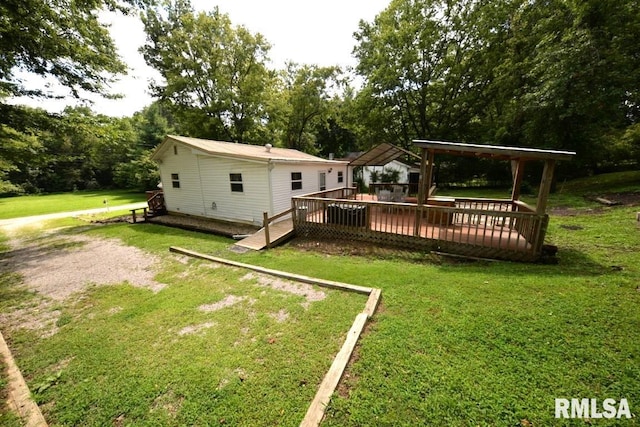 view of yard featuring a wooden deck