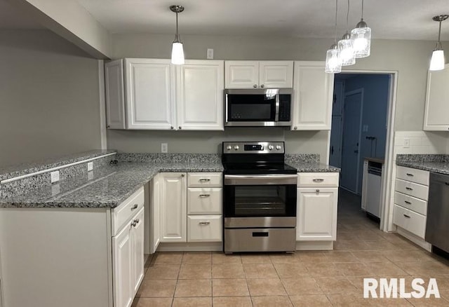 kitchen with white cabinetry, decorative light fixtures, and appliances with stainless steel finishes