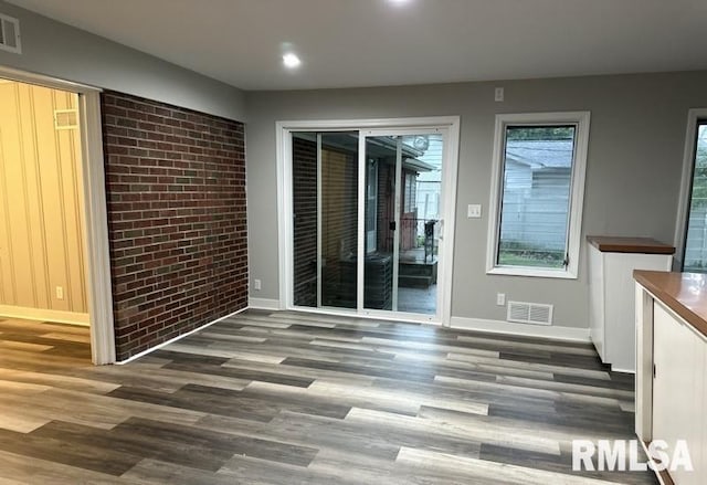 spare room featuring wood-type flooring