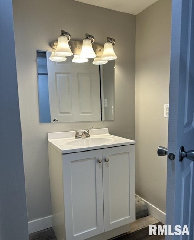 bathroom with wood-type flooring and vanity