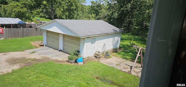 garage featuring a yard