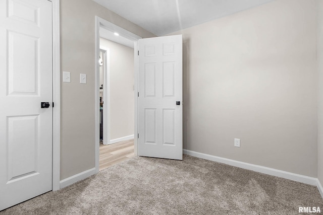 unfurnished bedroom with light carpet