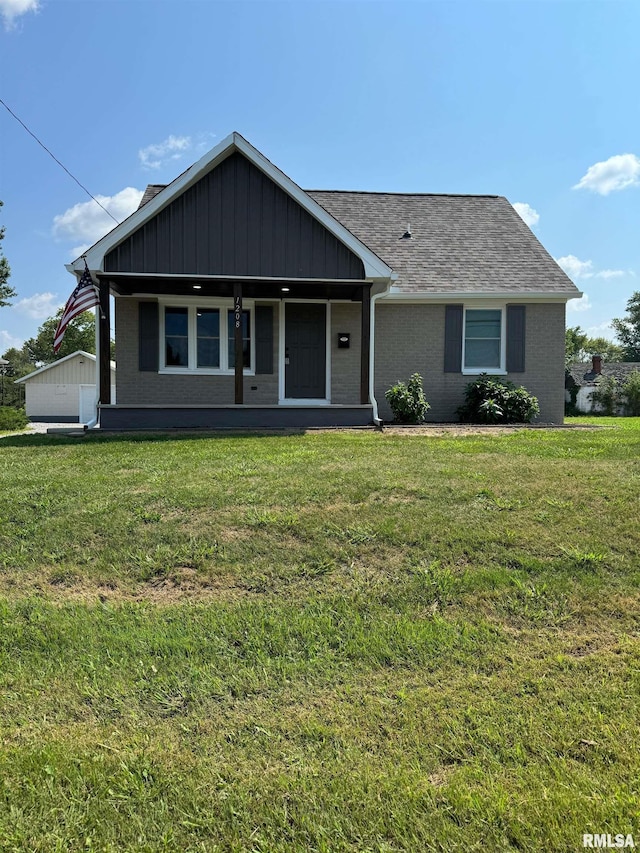 ranch-style home with a porch and a front yard