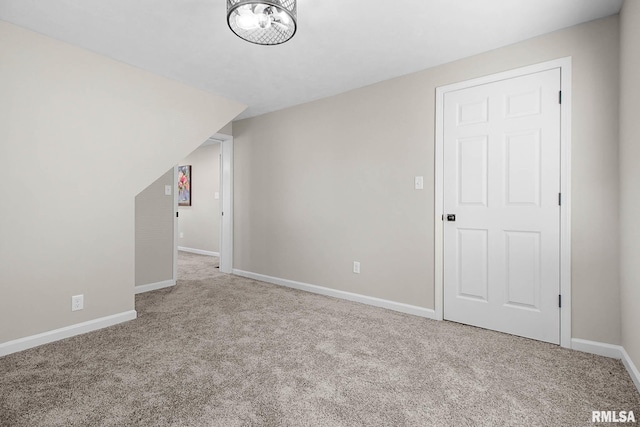 additional living space with light carpet