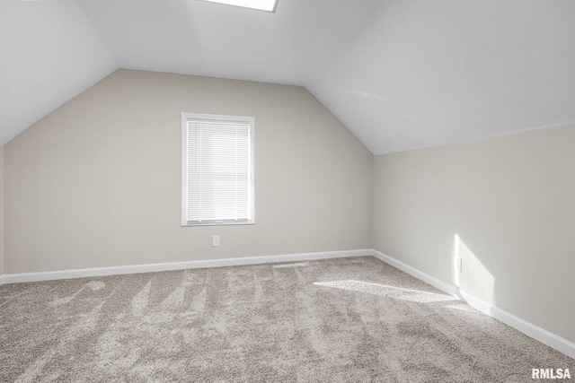 bonus room with lofted ceiling and carpet floors