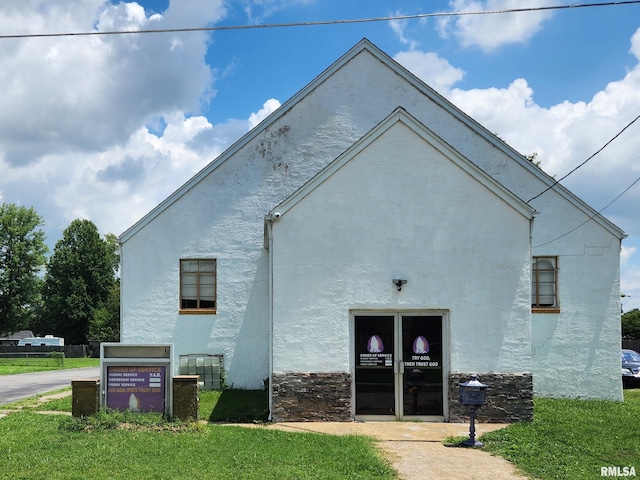 view of property exterior featuring a yard