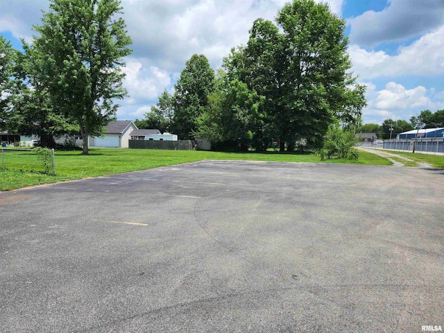 uncovered parking lot with fence