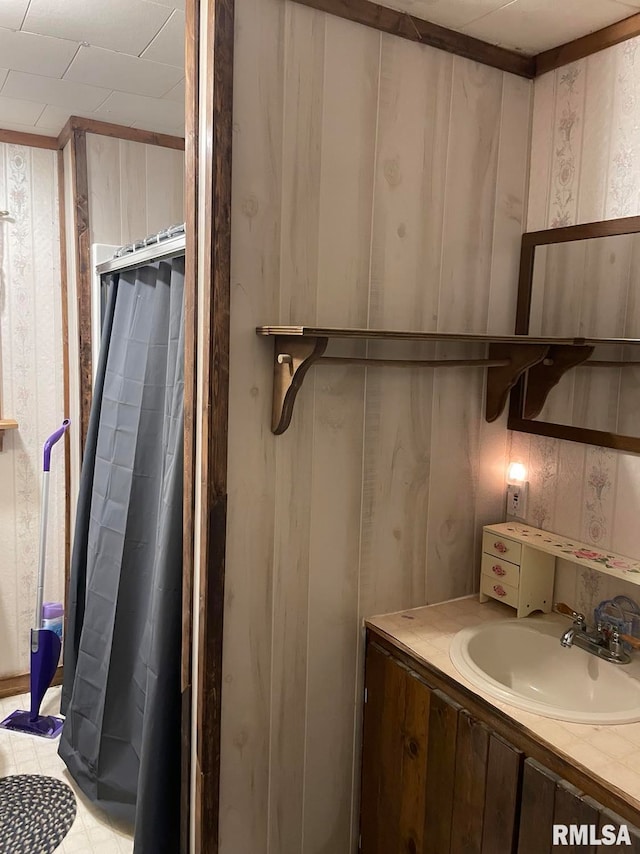 bathroom with tile patterned floors and vanity