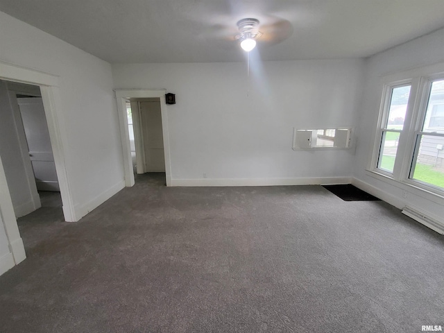 carpeted empty room featuring ceiling fan