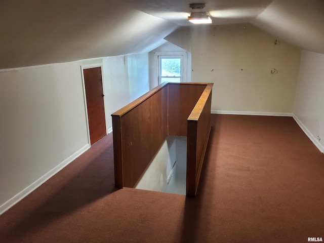 bonus room featuring vaulted ceiling and carpet floors