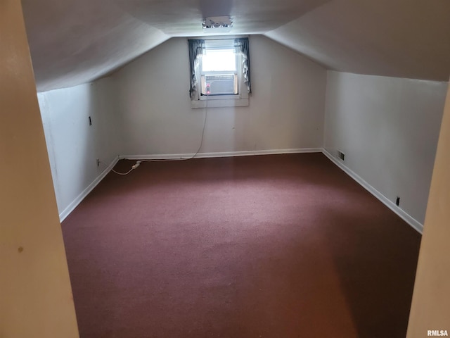 bonus room with cooling unit, carpet flooring, and vaulted ceiling