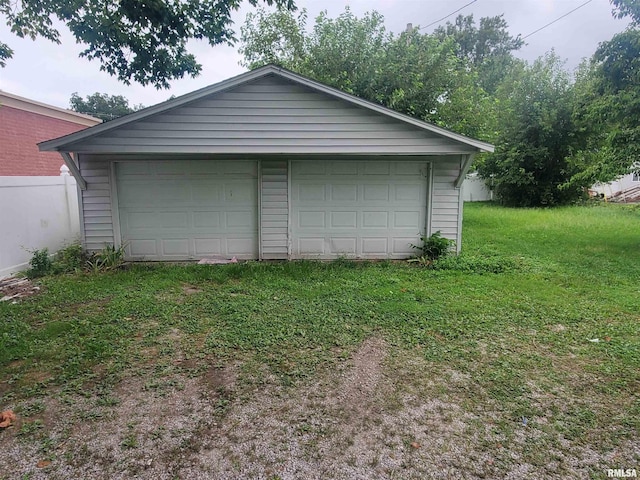 garage with a yard