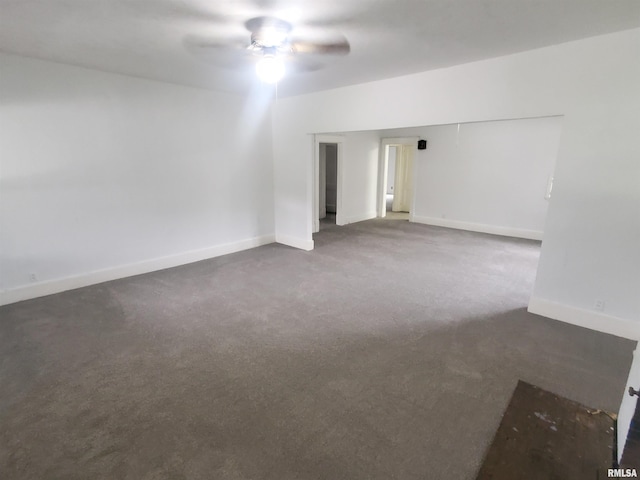 carpeted empty room featuring ceiling fan