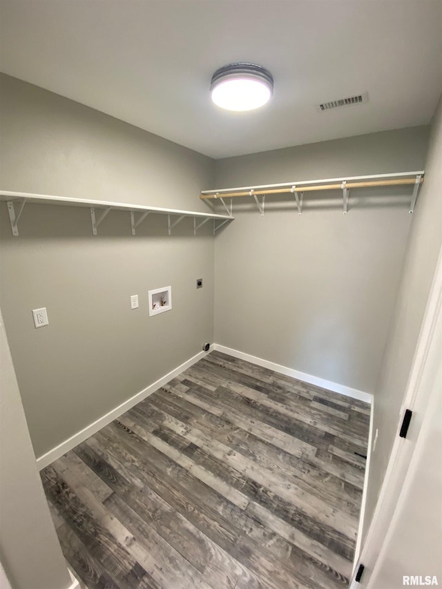 laundry room with washer hookup, dark hardwood / wood-style flooring, and electric dryer hookup