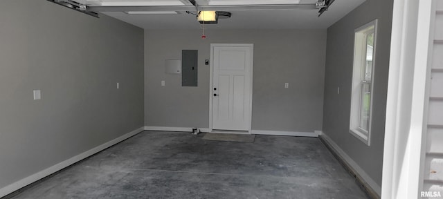 garage featuring a garage door opener and electric panel