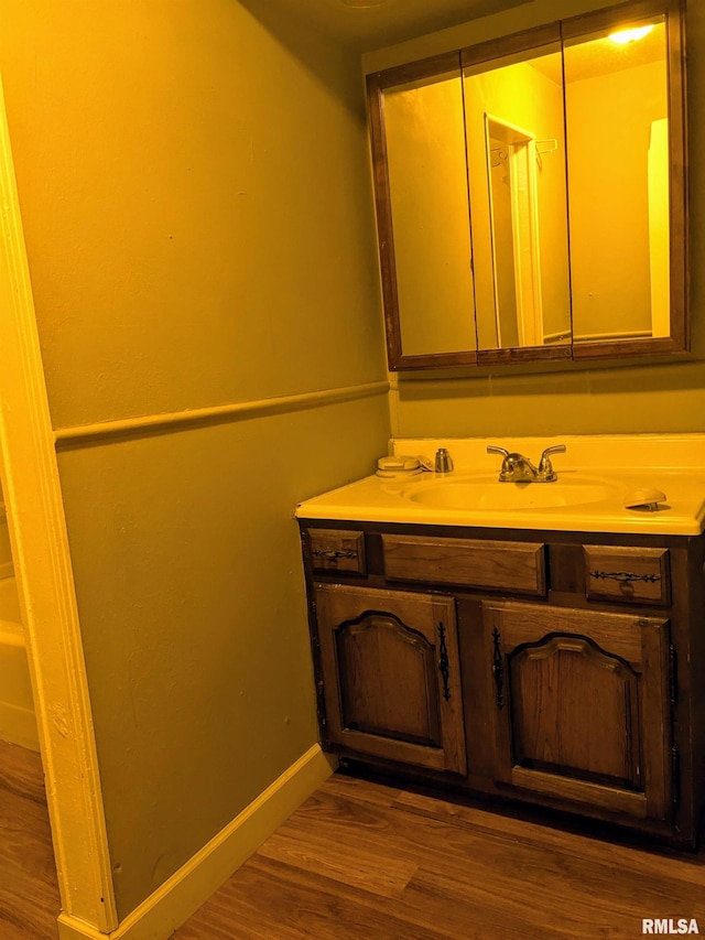 bathroom with wood-type flooring and vanity