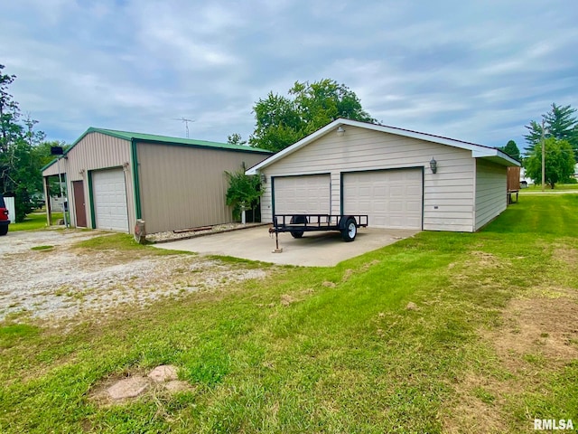 view of outbuilding featuring a yard and a garage