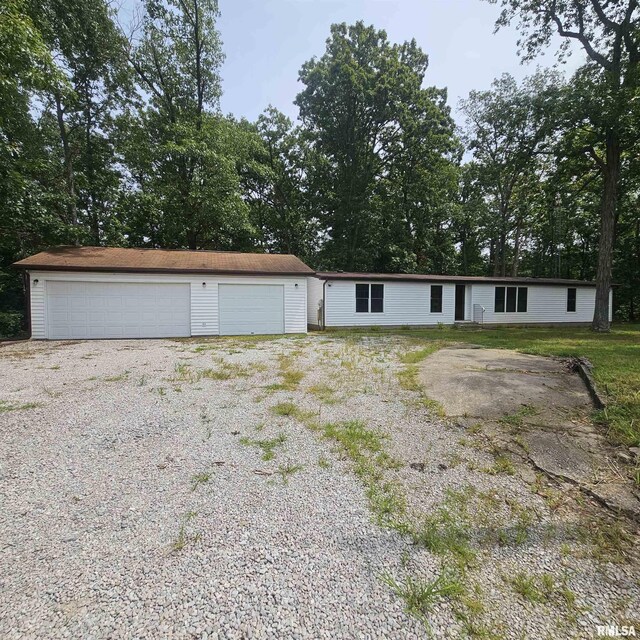 view of front facade with an outdoor structure and a garage