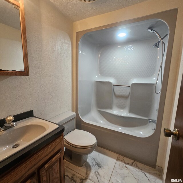 full bathroom featuring bathtub / shower combination, vanity, toilet, and a textured ceiling