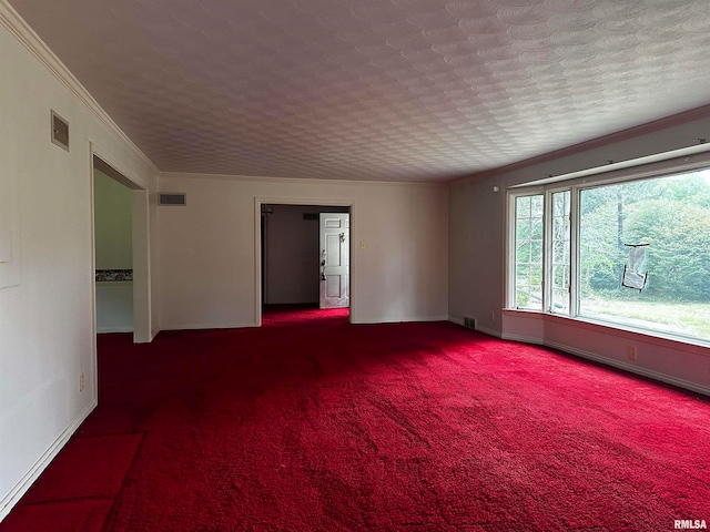 spare room with crown molding and carpet