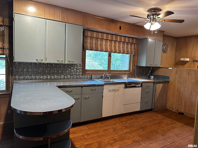 kitchen with decorative backsplash, ceiling fan, hardwood / wood-style flooring, and white cabinetry