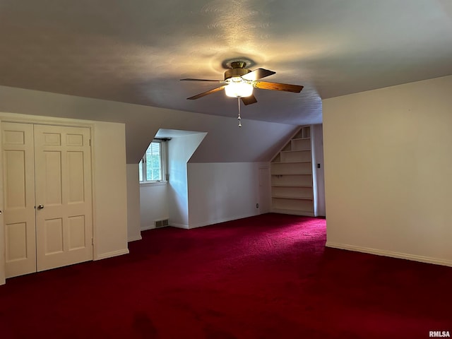 bonus room with lofted ceiling, carpet flooring, and ceiling fan