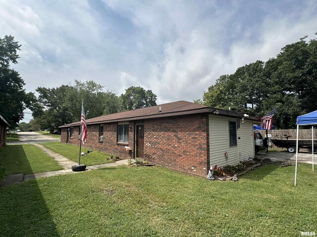2202 Illinois Ave Unit 3 & 4, Murphysboro, IL 62966 - exterior space with brick siding, a shingled roof, and a front lawn