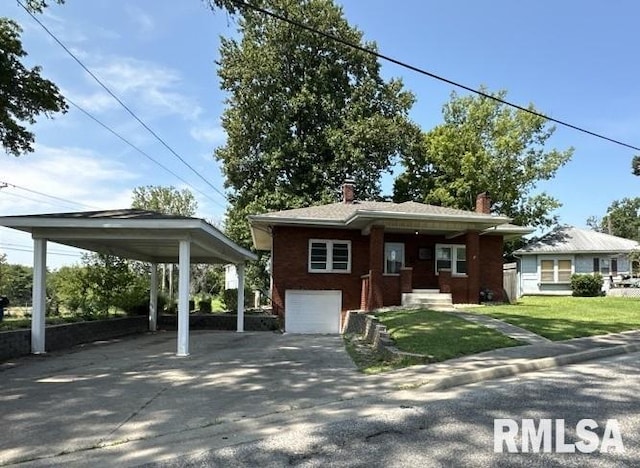 view of front of property with a garage, a carport, and a front yard