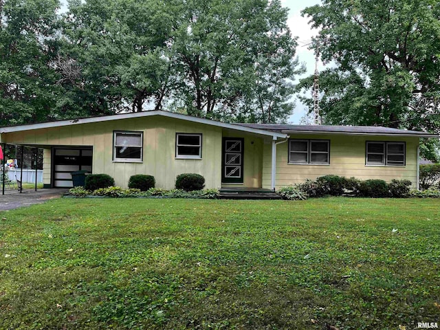 ranch-style home with a garage and a front lawn