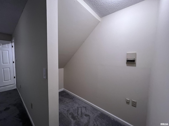 bonus room with a textured ceiling, carpet floors, lofted ceiling, and baseboards