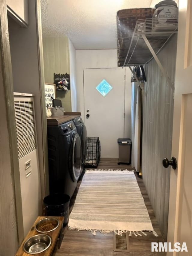 laundry area featuring dark hardwood / wood-style floors and separate washer and dryer