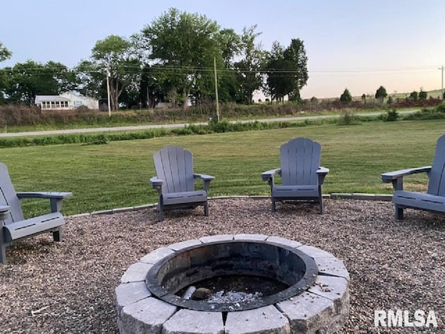 yard at dusk with an outdoor fire pit