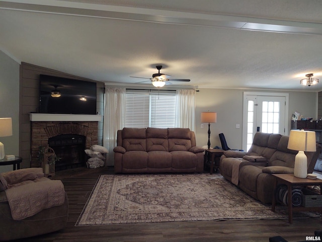 living room featuring ceiling fan and dark wood-type flooring