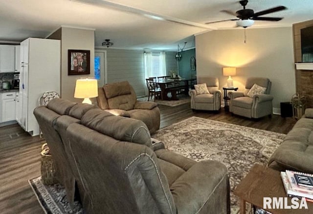 living room with hardwood / wood-style flooring and ceiling fan