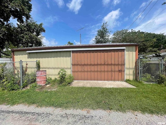 view of outbuilding with a yard