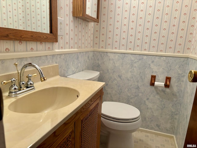 bathroom with toilet and vanity