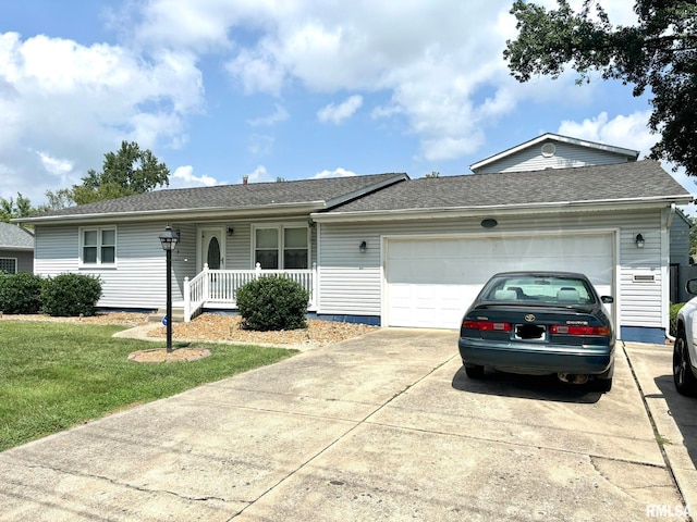 single story home featuring covered porch, a front yard, and a garage