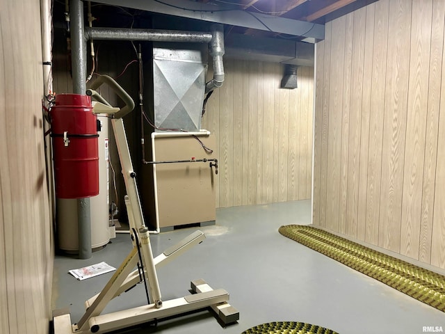 interior space featuring wood walls and heating unit