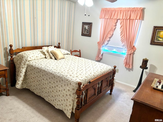 bedroom featuring light carpet and ceiling fan