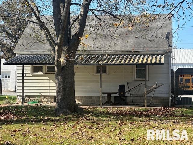 view of side of property with cooling unit