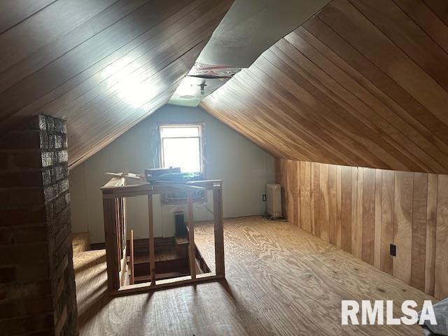 bonus room with wood walls, wooden ceiling, and vaulted ceiling