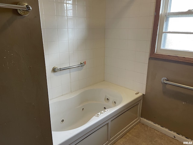 bathroom featuring tile patterned flooring and a bath