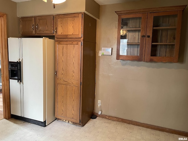 kitchen with white refrigerator with ice dispenser