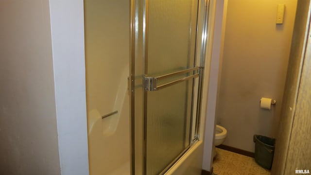 bathroom with tile patterned flooring and toilet